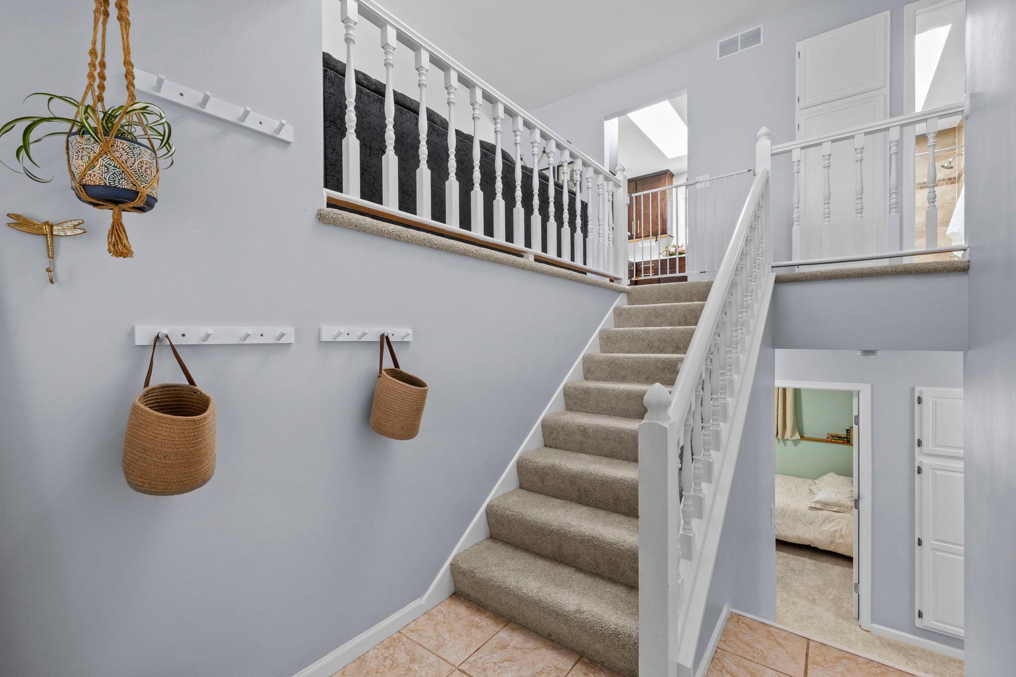 From the moment you walk in, the welcoming entry with 13-ft ceilings creates a sense of openness, paired with practical closet space that keeps things organized from the start.
