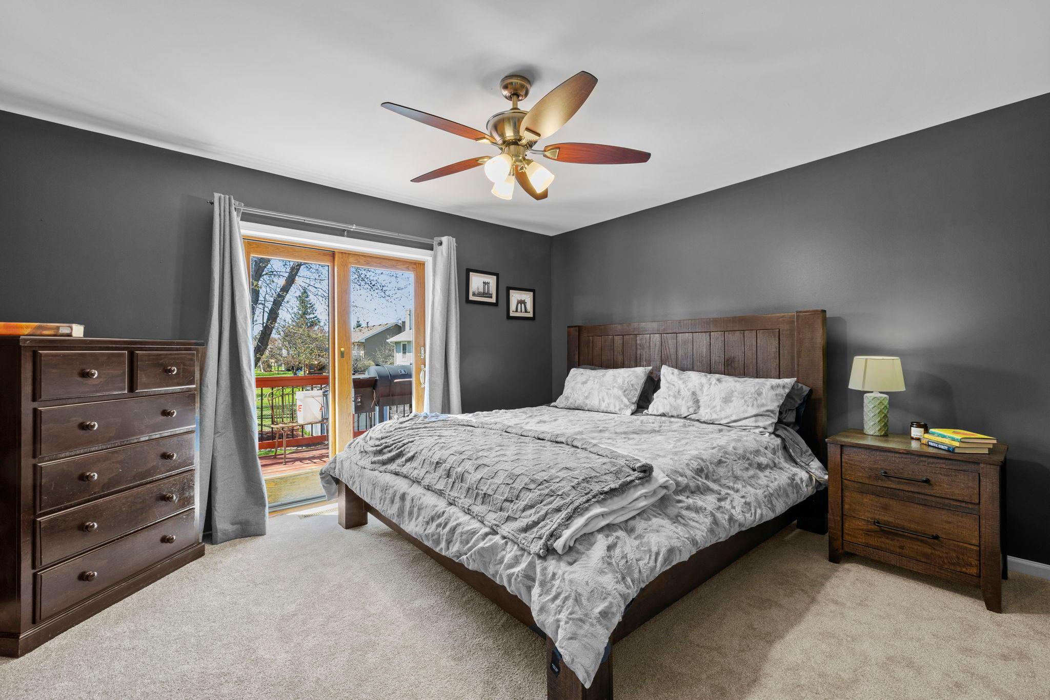 Two bedrooms sit on this level, including a spacious primary with a well-designed closet and its own walkout to the deck.