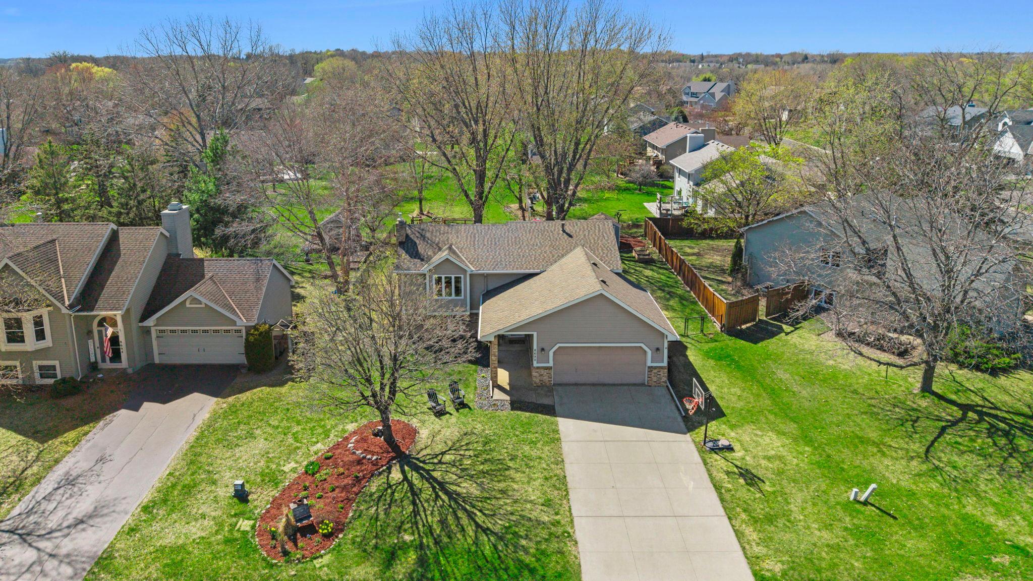 The attached two-car garage is equally functional, with a built-in workbench and cabinetry.
