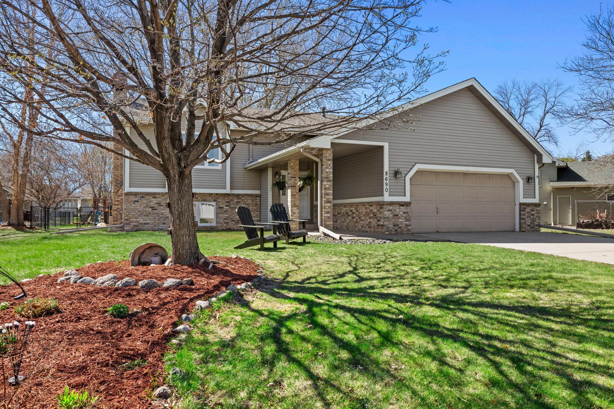 The front yard adds a fun touch with a basketball hoop and welcoming curb appeal.