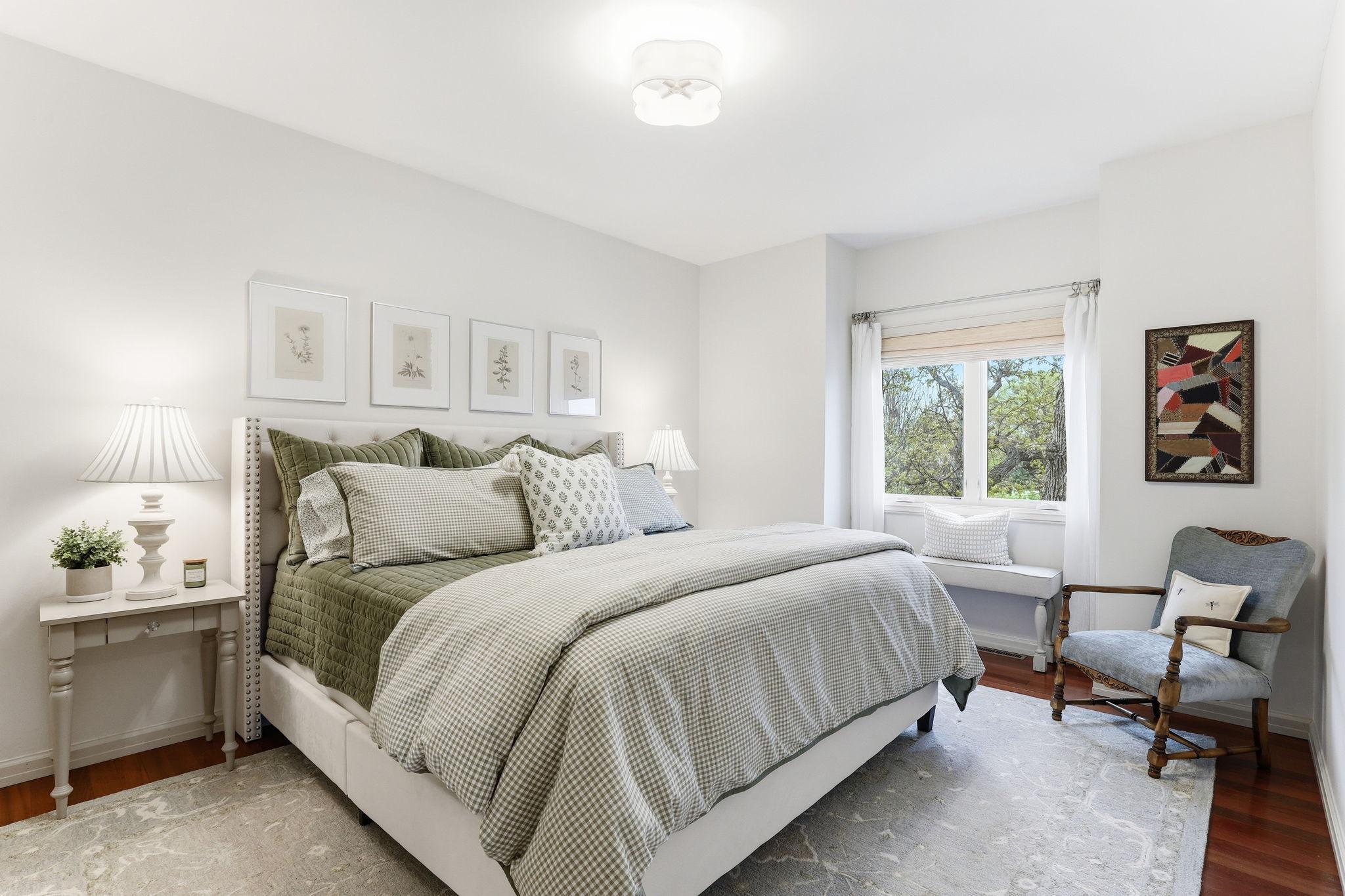 The additional bedrooms on the upper level are generously sized, offering bright natural light and refined finishes throughout - this is the second additional bedroom.