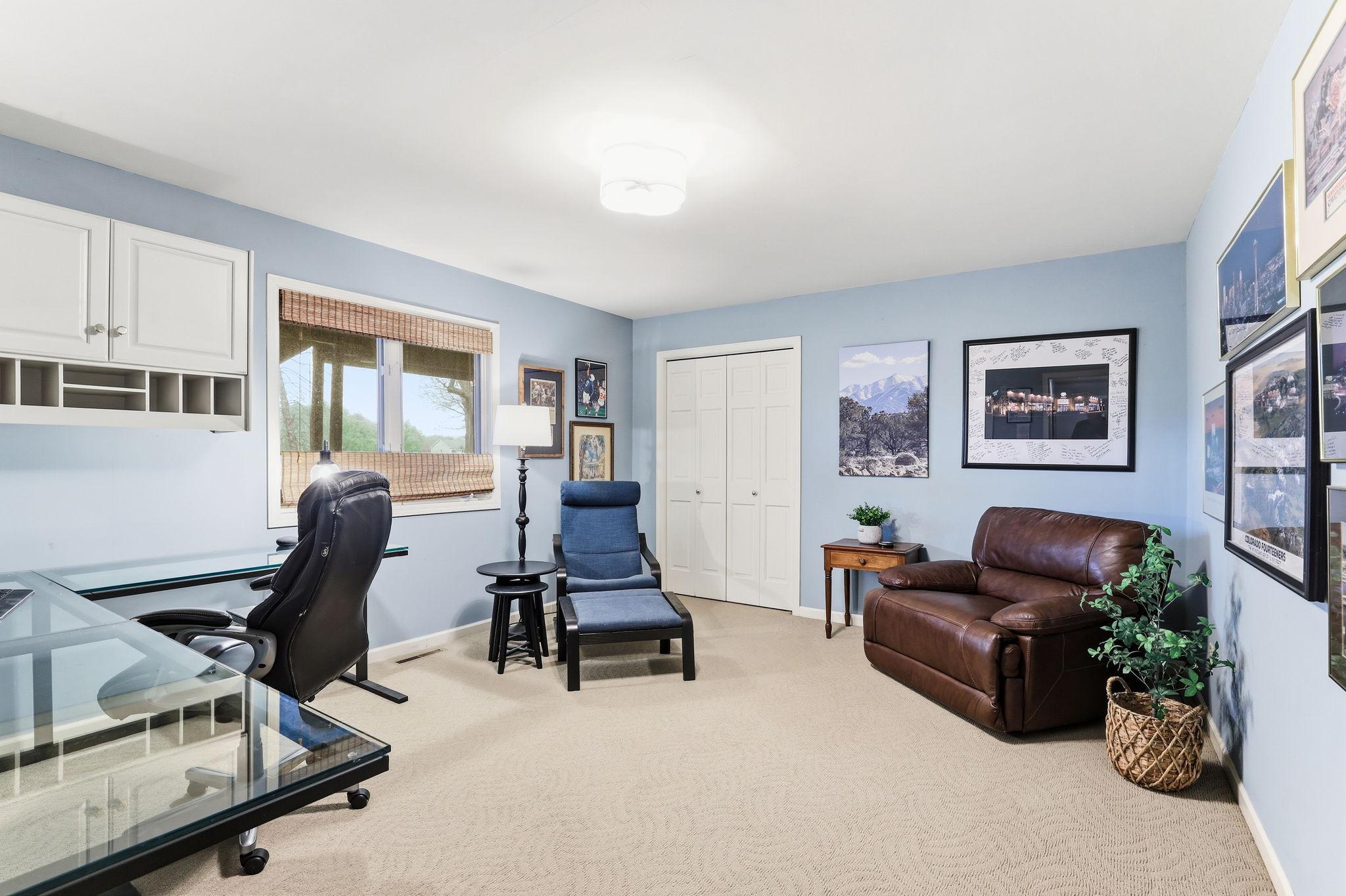 The lower-level bedroom feels bright and inviting, featuring generous space for a full bedroom setup and stylish finishes throughout. Whether used as a guest suite, teen retreat, or home office, it provides exceptional comfort and flexibility.