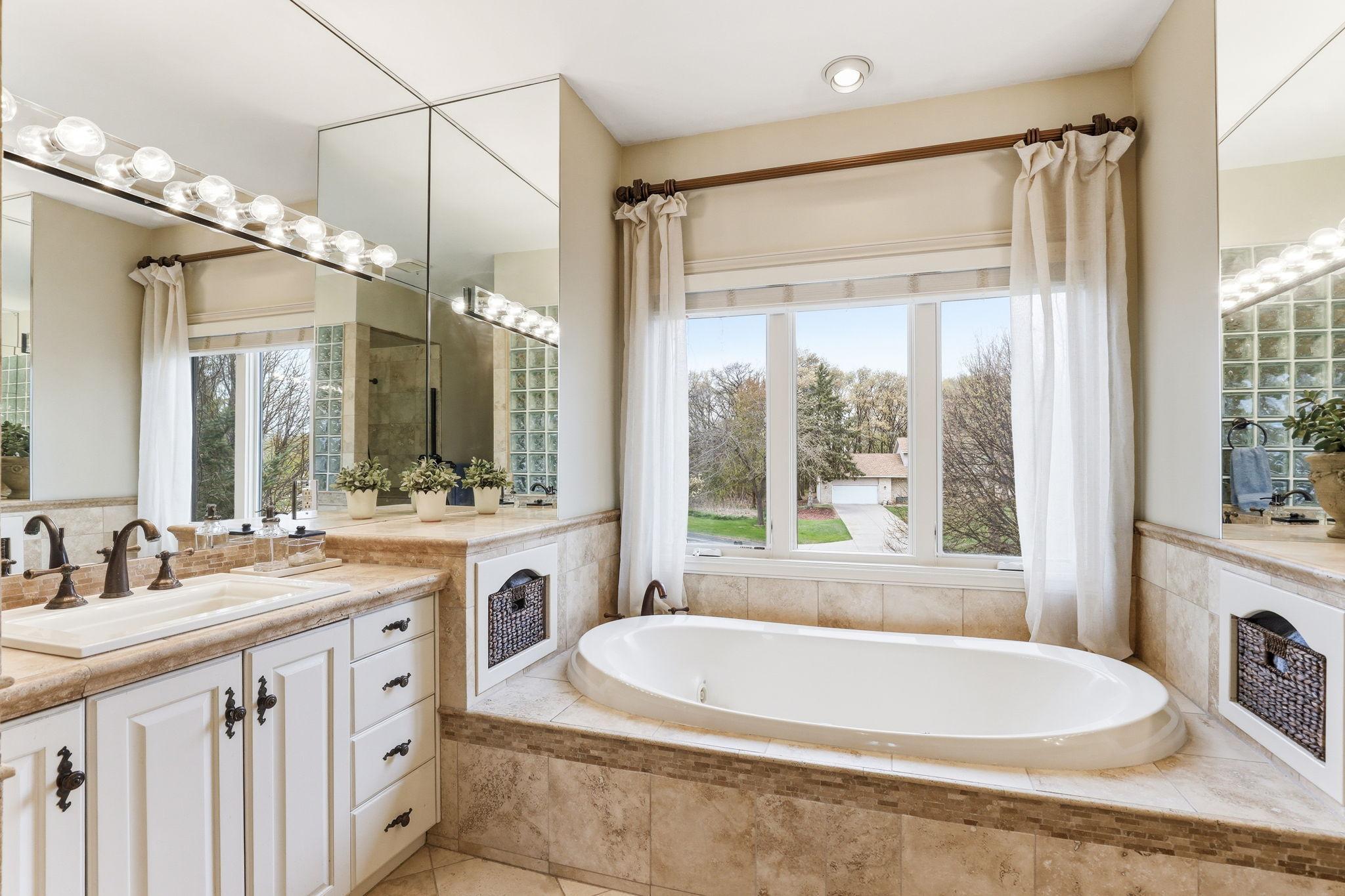 The private ensuite bath showcases elegant fixtures and thoughtful details, creating a relaxing retreat.