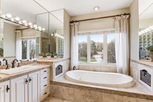 The private ensuite bath showcases elegant fixtures and thoughtful details, creating a relaxing retreat.