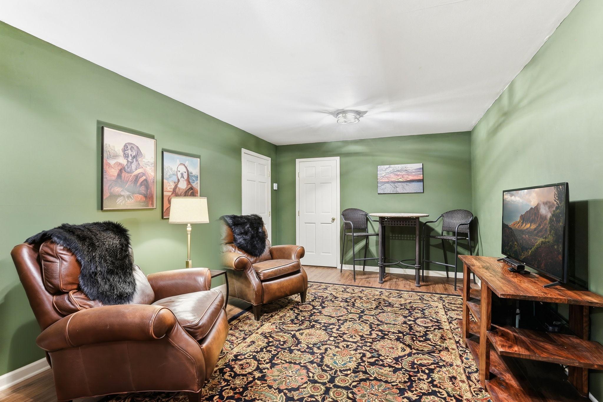 The main-floor bonus room provides a warm and welcoming atmosphere, highlighted by its impressive size and thoughtful layout. Perfect for a cozy family hangout, hobby space, or additional living area, it adapts easily to a variety of needs.
