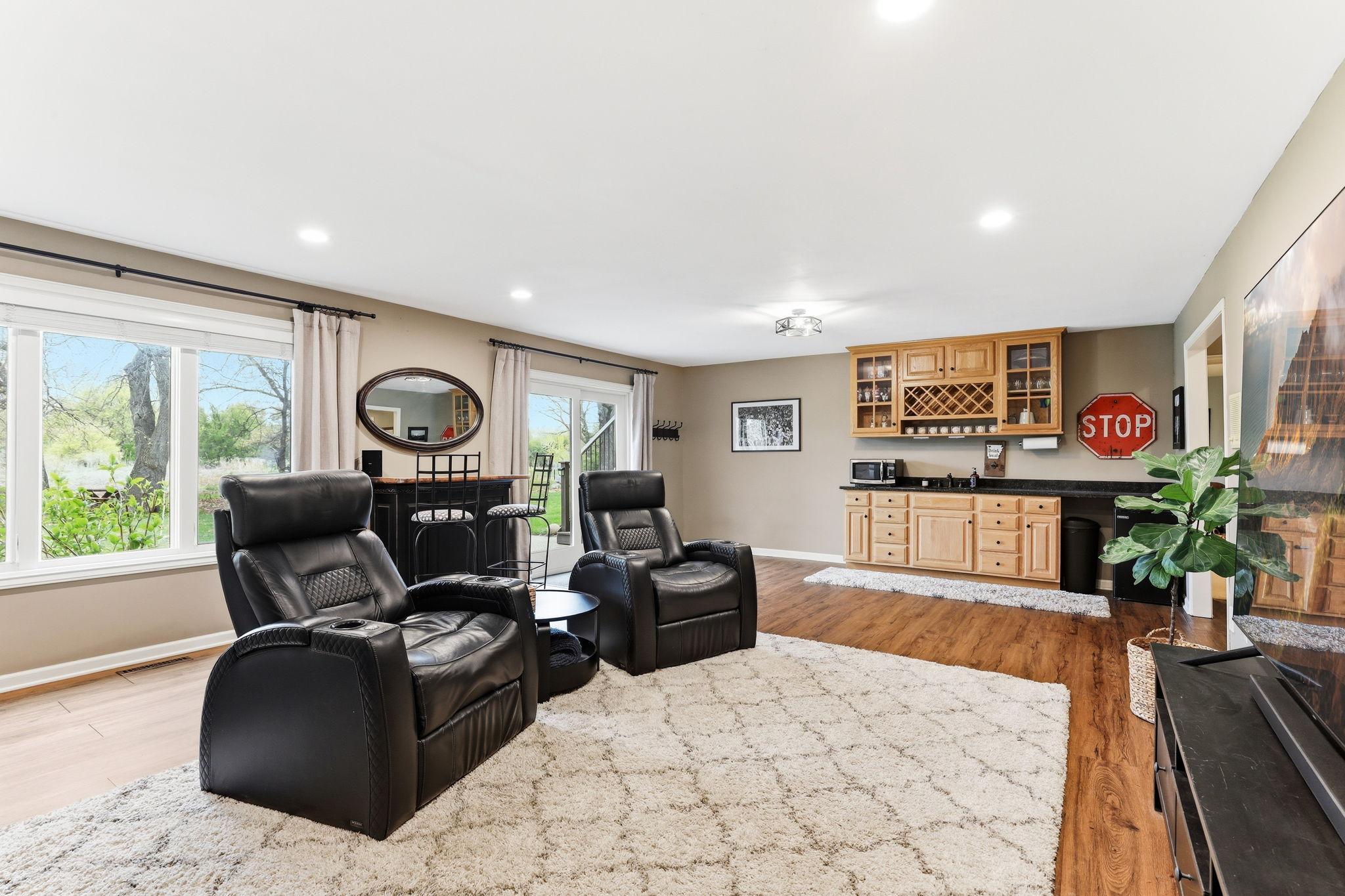 This beautifully designed wet bar enhances the lower level with warm finishes, generous counter space, and built-in storage for all your bar essentials.