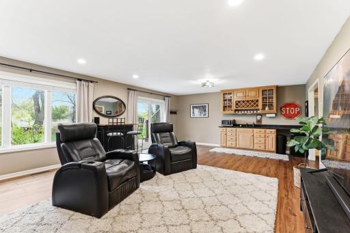 This beautifully designed wet bar enhances the lower level with warm finishes, generous counter space, and built-in storage for all your bar essentials.