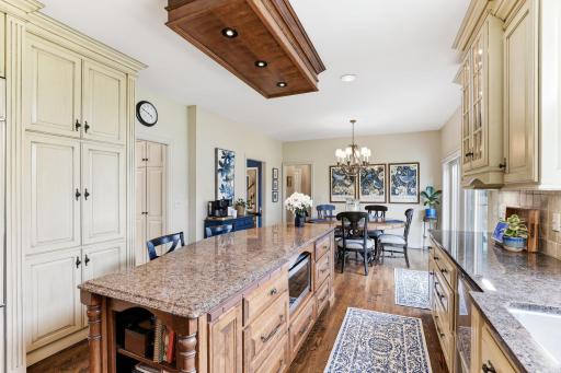 A bold center island serves as the focal point, featuring premium countertops, integrated storage.