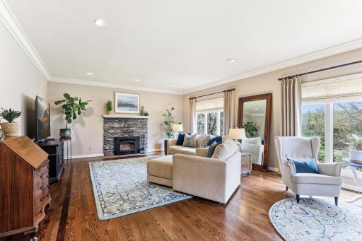 Living room blends luxury with comfort, showcasing beautifully finished hardwood floors that complement the roomâs warm color palette.