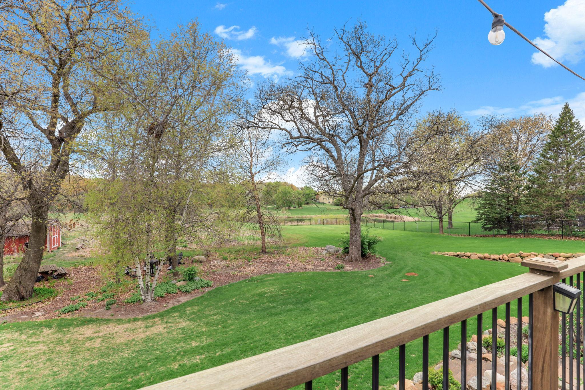 Set on an expansive 2.7 acres, the property is beautifully defined by brand-new black aluminum decorative fencing that adds a refined, upscale presence to the landscape.