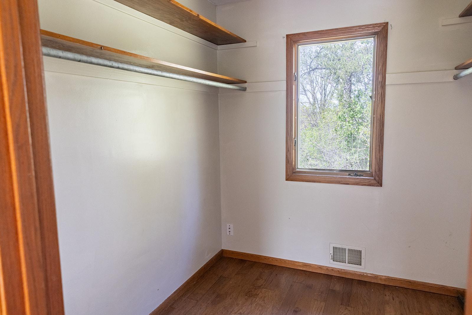 Primary walk-in closet even has a window