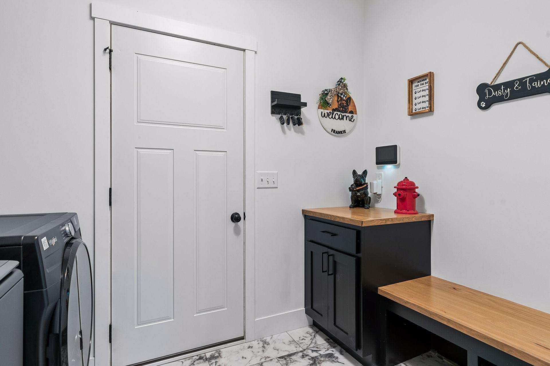 Mudroom with bench and drop zone---perfect for gathering all the everyday important items as you come and go