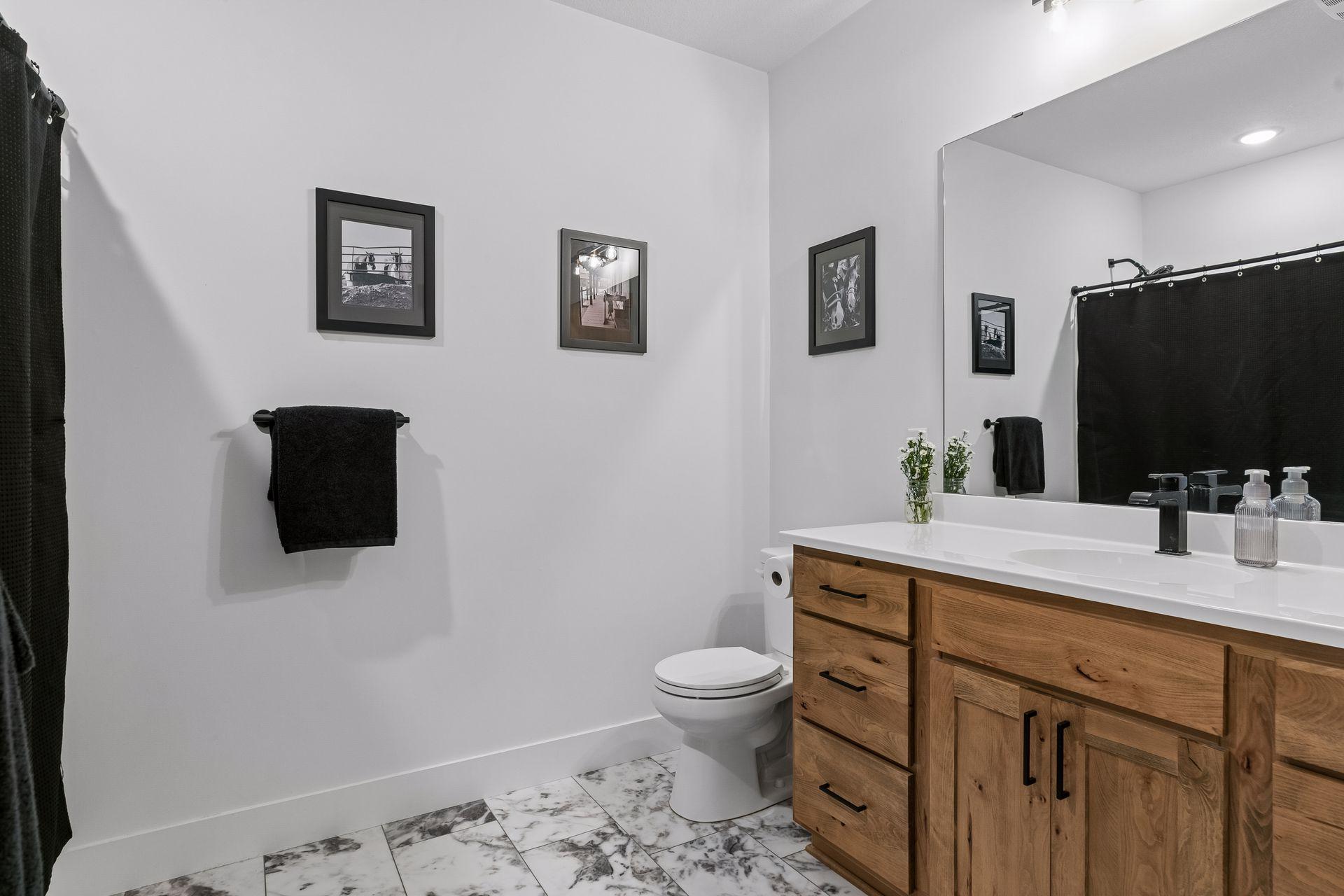 Bath in lower level for guests and visitors and/or use by 4th and 5th bedrooms