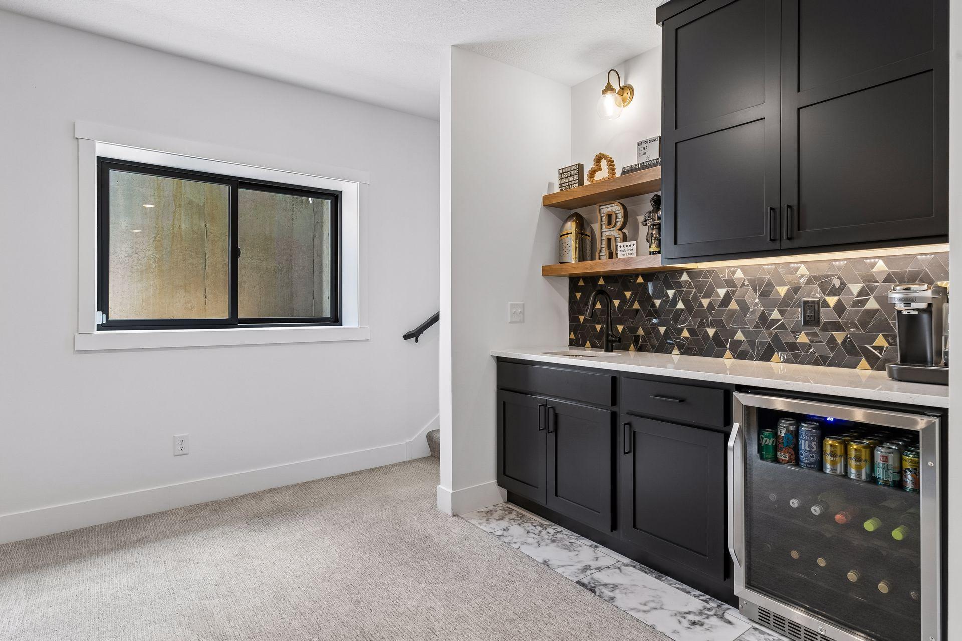 Side var in family room with beverage refrigerator. Perfect for serving up refreshments during the big game or movie night
