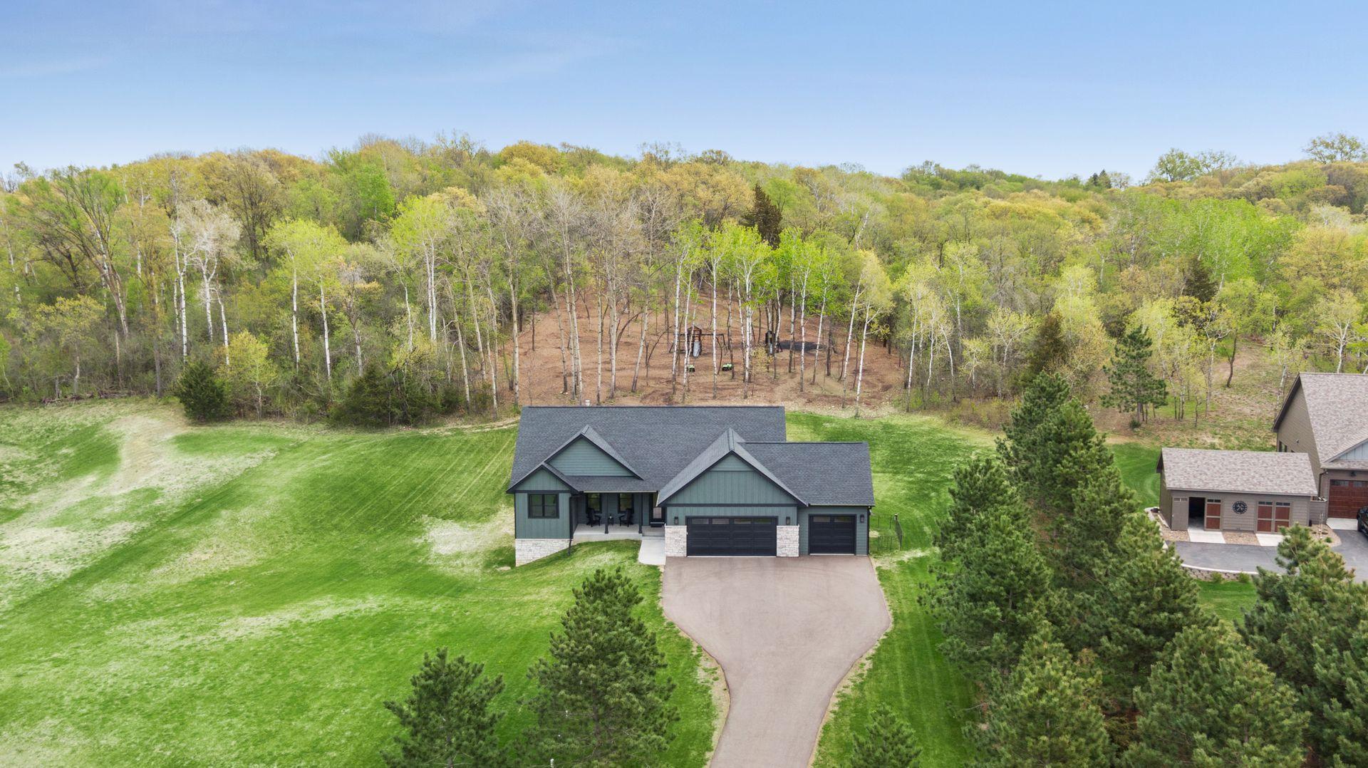 Amazing stand of trees act as nature's backdrop for this home