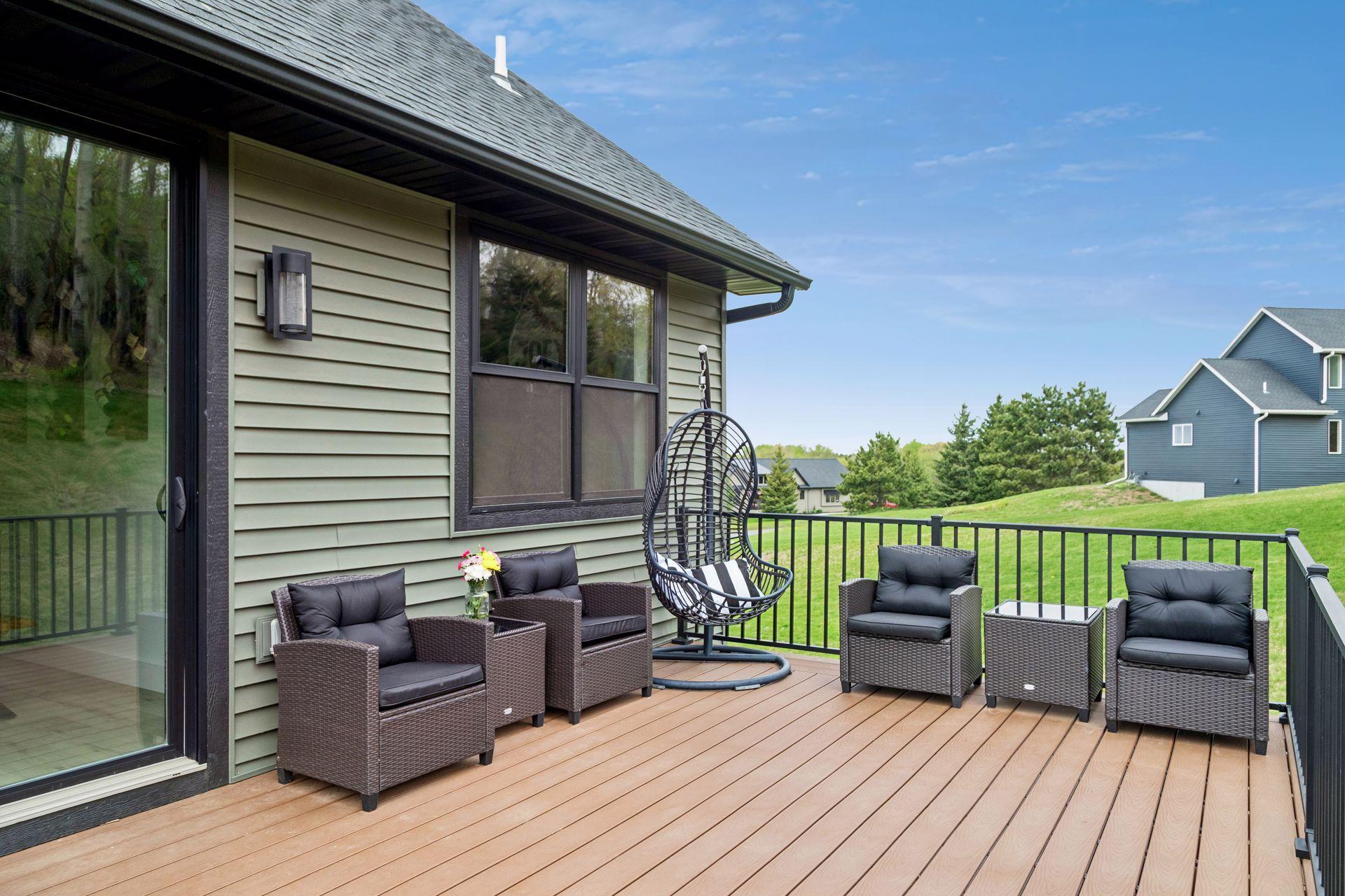 Roomy composite deck out back---great for morning coffee enjoying the birds and wildlife or cooking out and entertaining friends and family