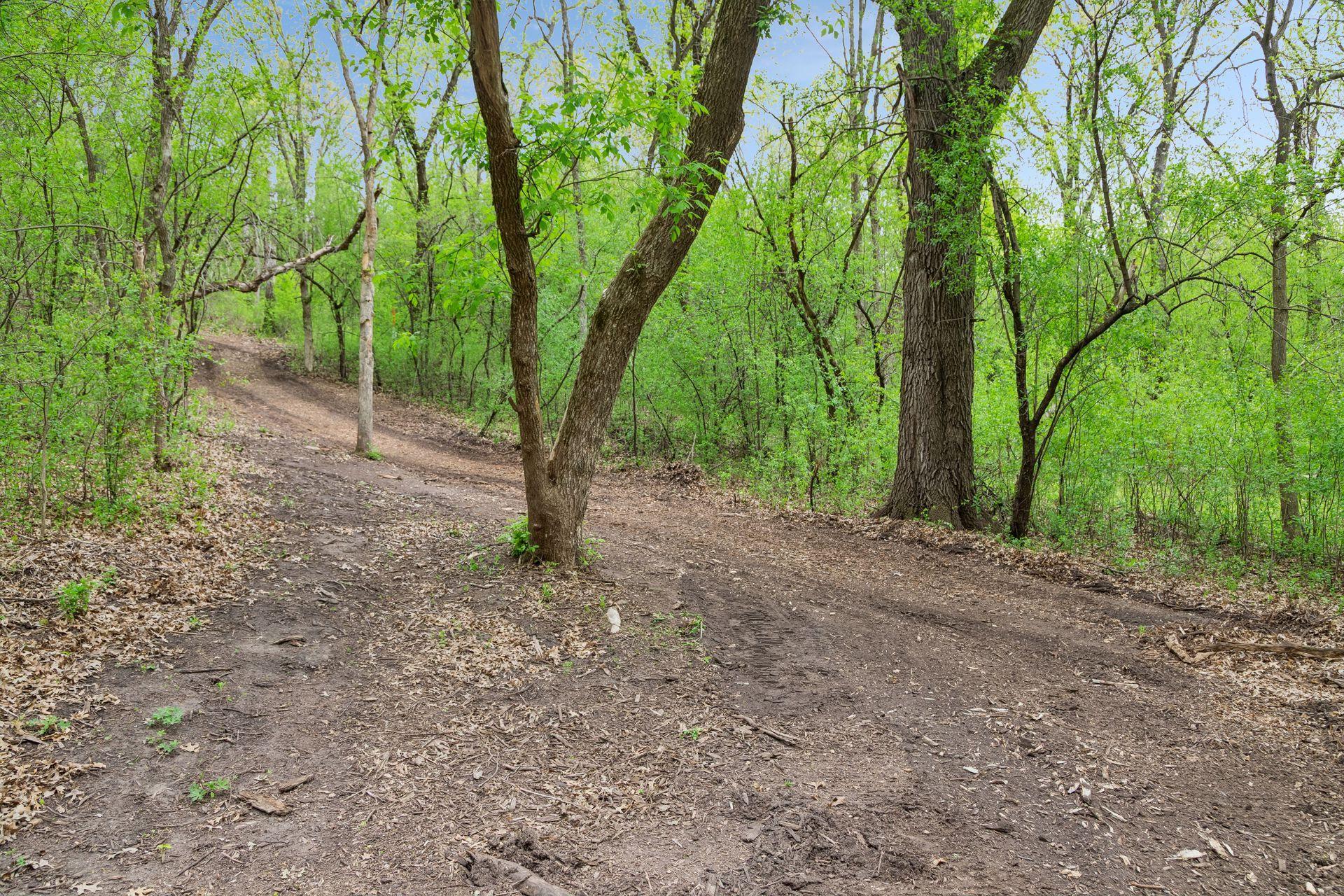 The owners' of this great home have done all the work for you! A beautiful trail has been cleared through this 3 acre lot. Walk your dog, go for a hike after dinner, let the kids run, snow shoe or 4 wheel on your own property.