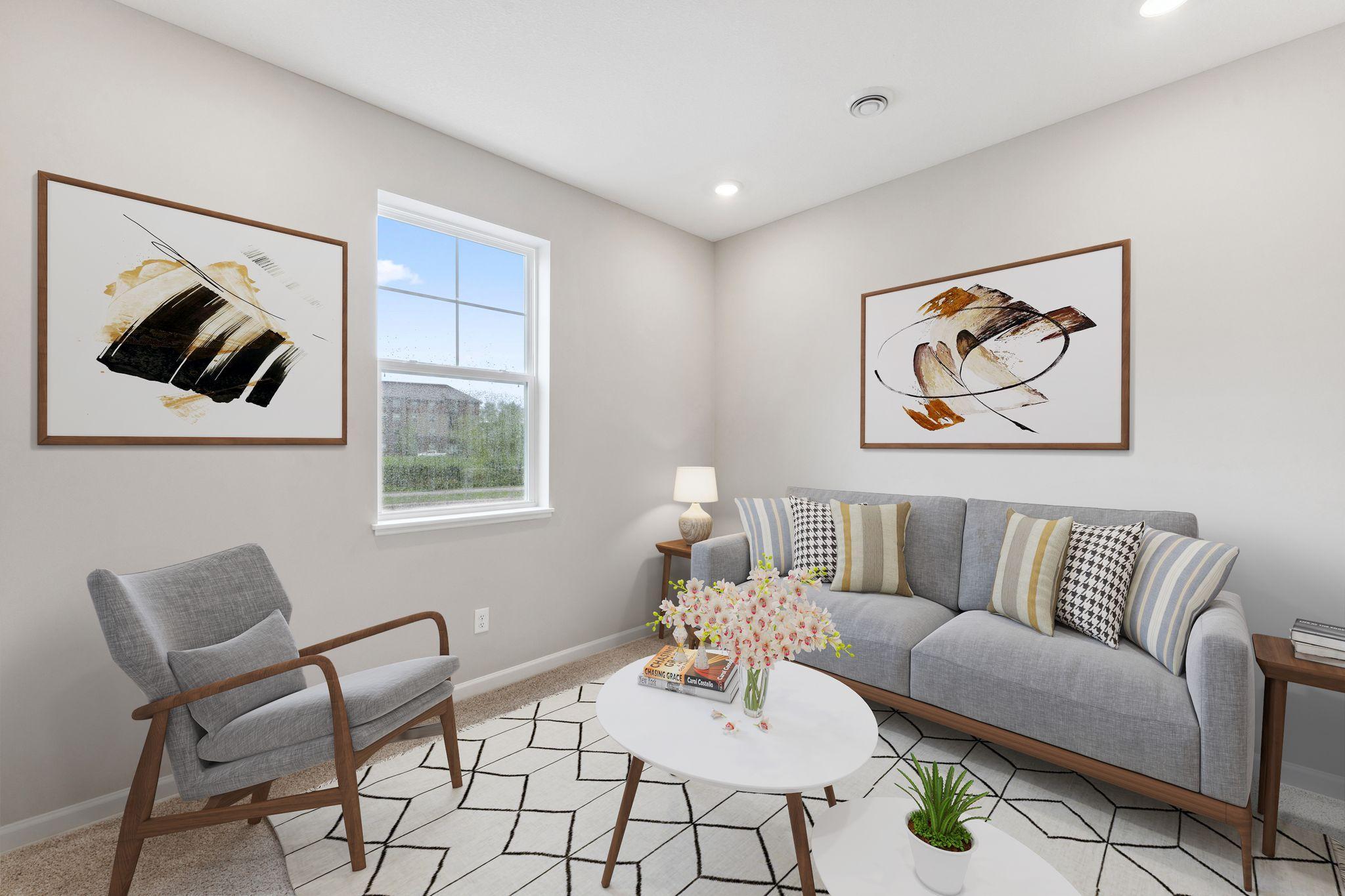 Rec room staged. Similar home shown, color and options can vary.