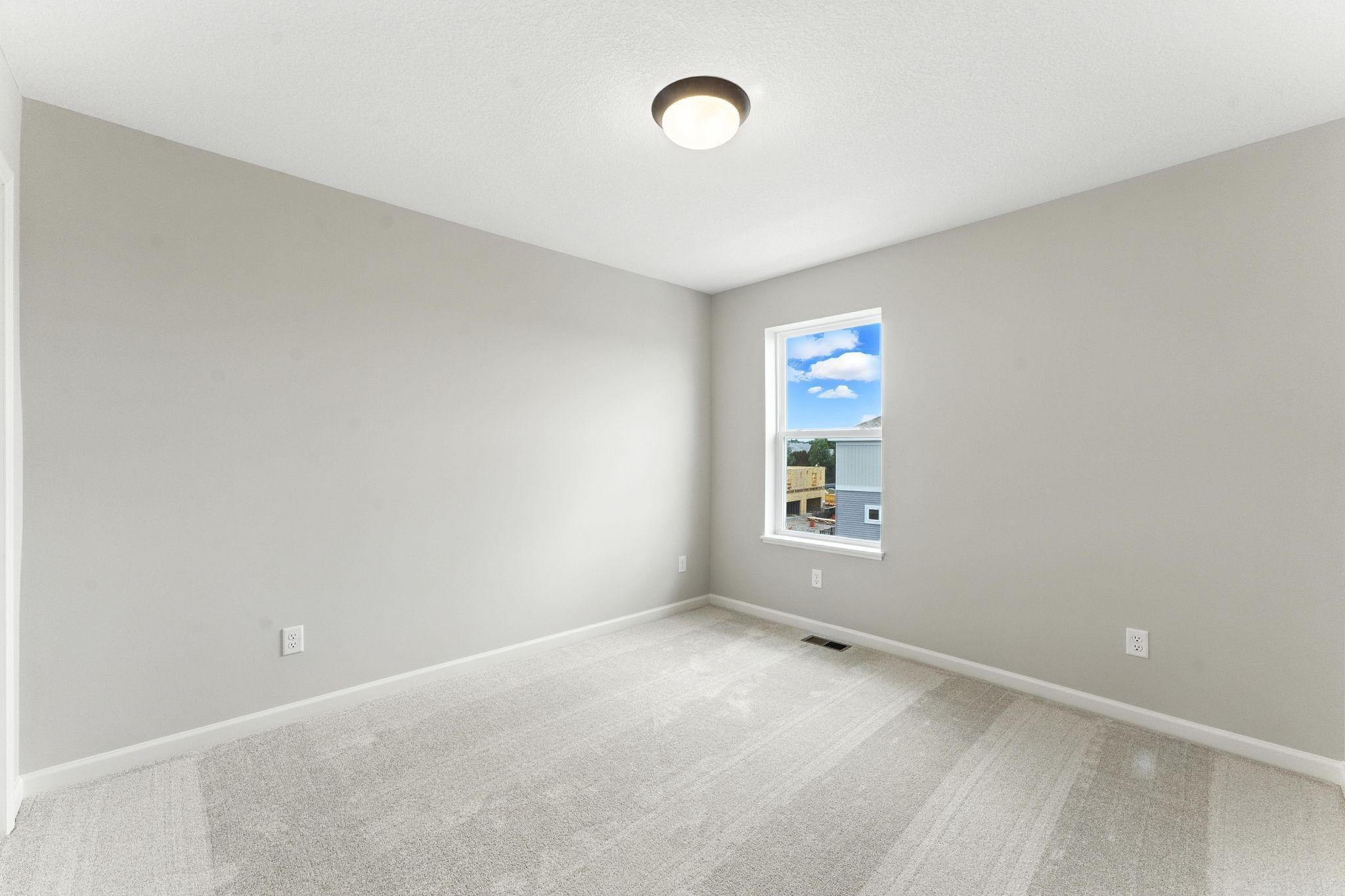 One of two secondary bedrooms.
