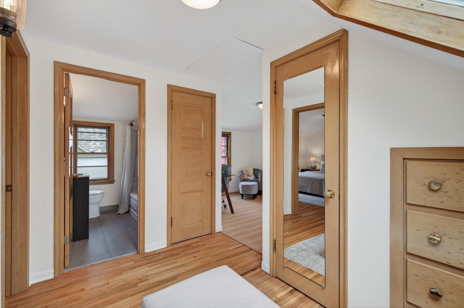 The second floor features a primary suite with a full bathroom, large bedroom, and flex space.