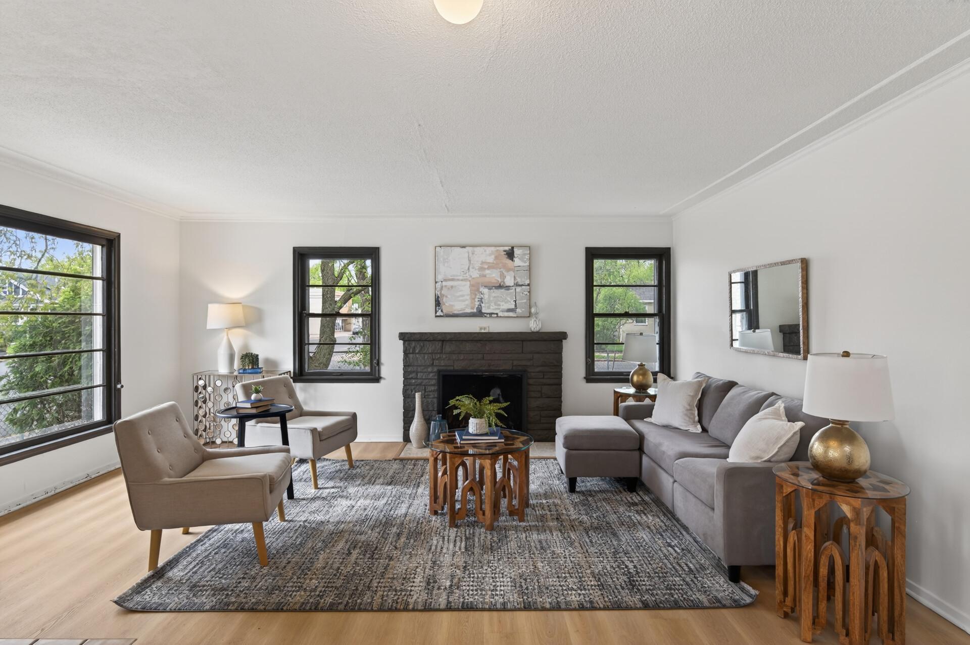 The large living room focuses around the wood-burning fireplace.