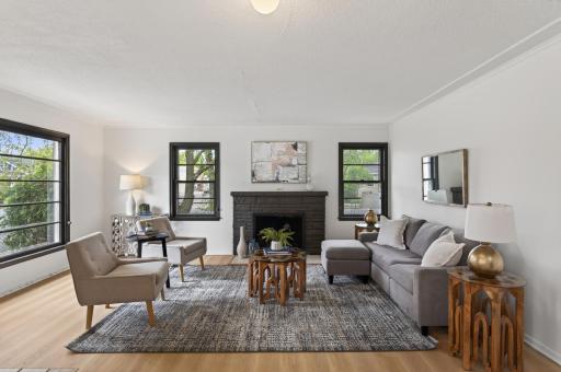 The large living room focuses around the wood-burning fireplace.