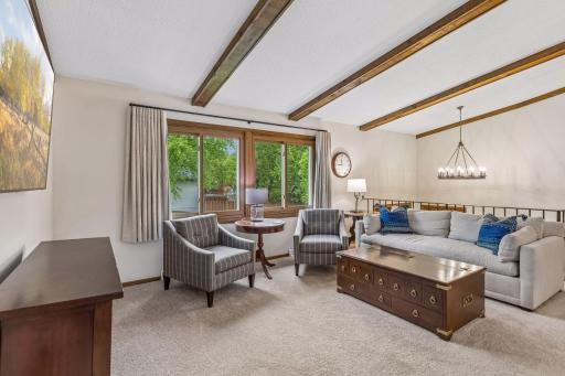 Vaulted family room connects dining and kitchen.