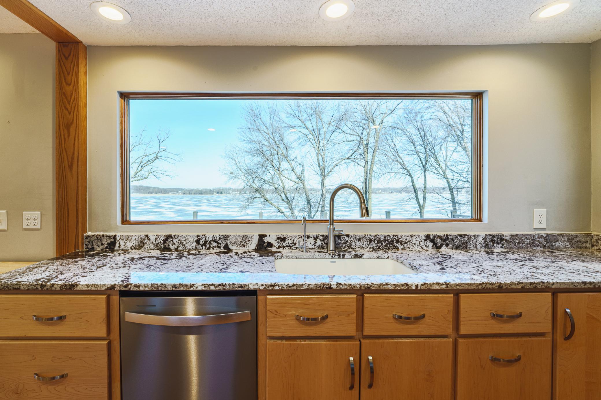 NEW Andersen windows sparkle in this home from the outside. From the inside, the windows offer incredible views all year. NEW GLORIOUS PICTURE WINDOWS allow you take in a seamless panoramic view! The windows make great statements in this home!