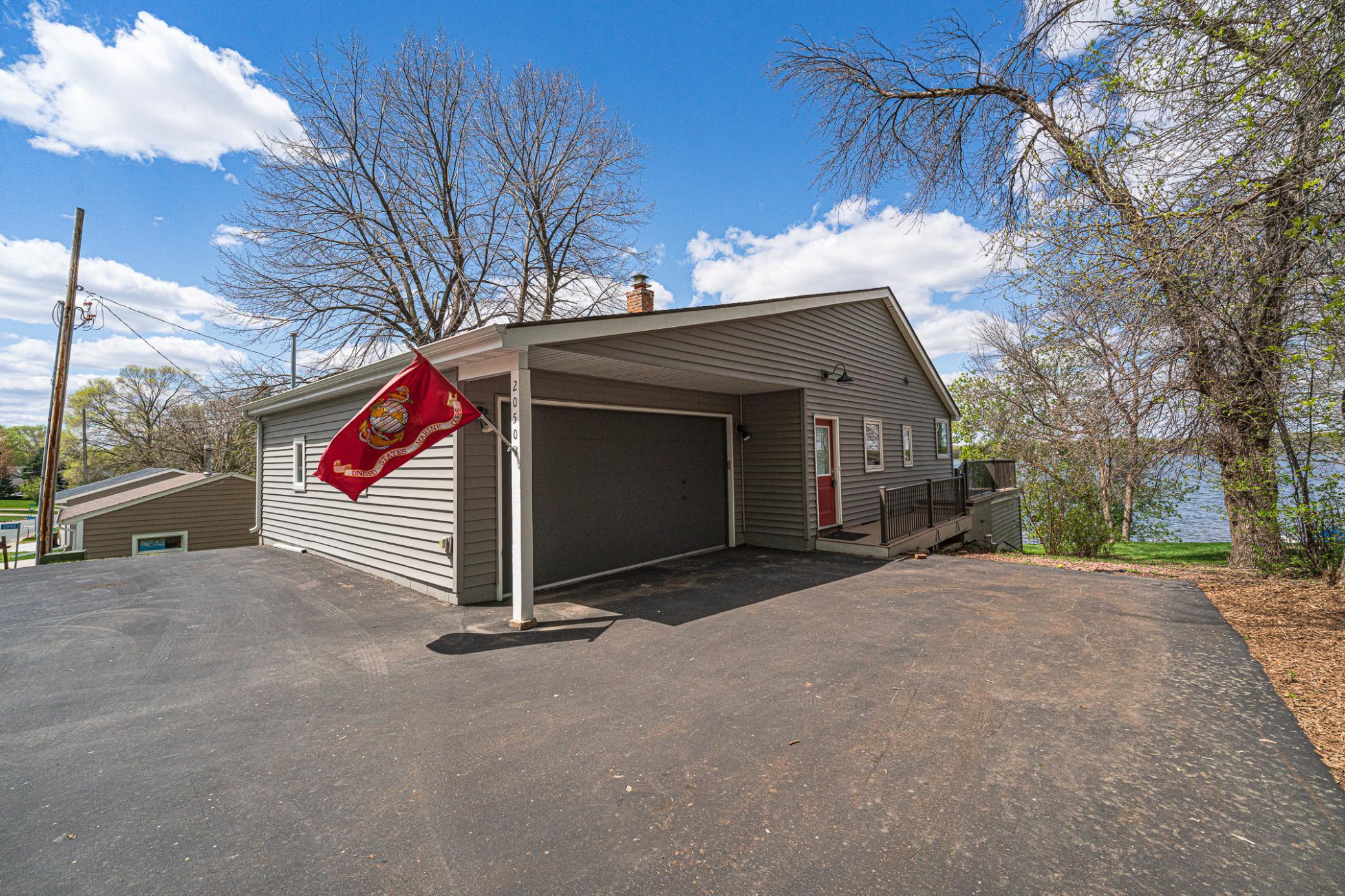 From the moment you pull in the driveway, you'll see the lake beyond the home.