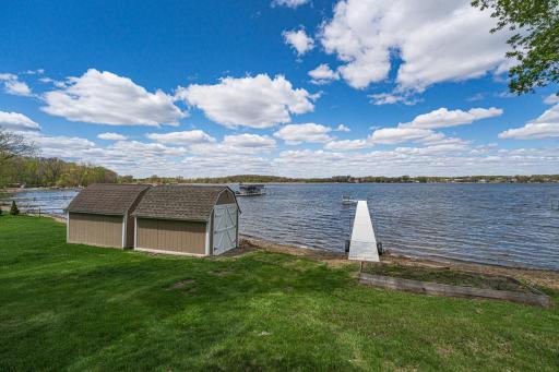 This property includes a NEW ALUMINUM DOCK and a lakeside boat house/storage shed.