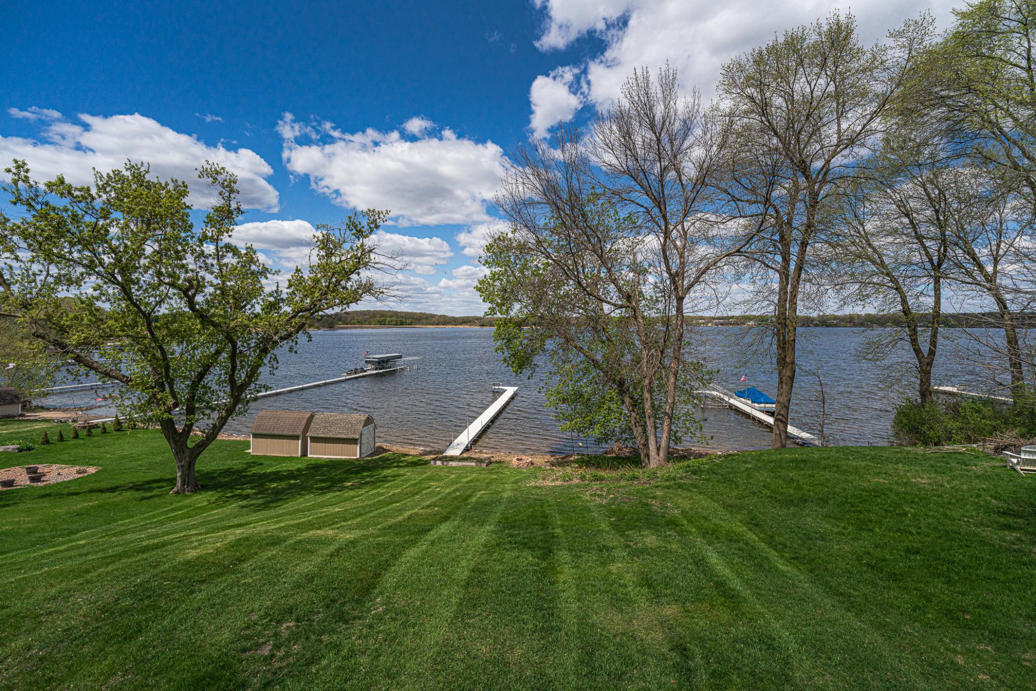 This lush, emerald green lawn can be enjoyed from the deck or four-season porch while sitting in your hot tub!