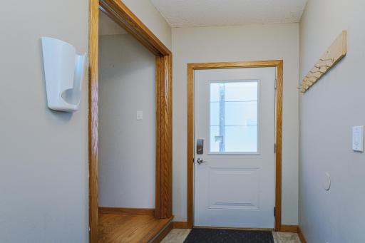 The entrance off the garage was added in 2018 and is a handy place to store boots and coats out of sight from the open main floor. This space has both a front door, and a door to the garage. There is also a pocket door.