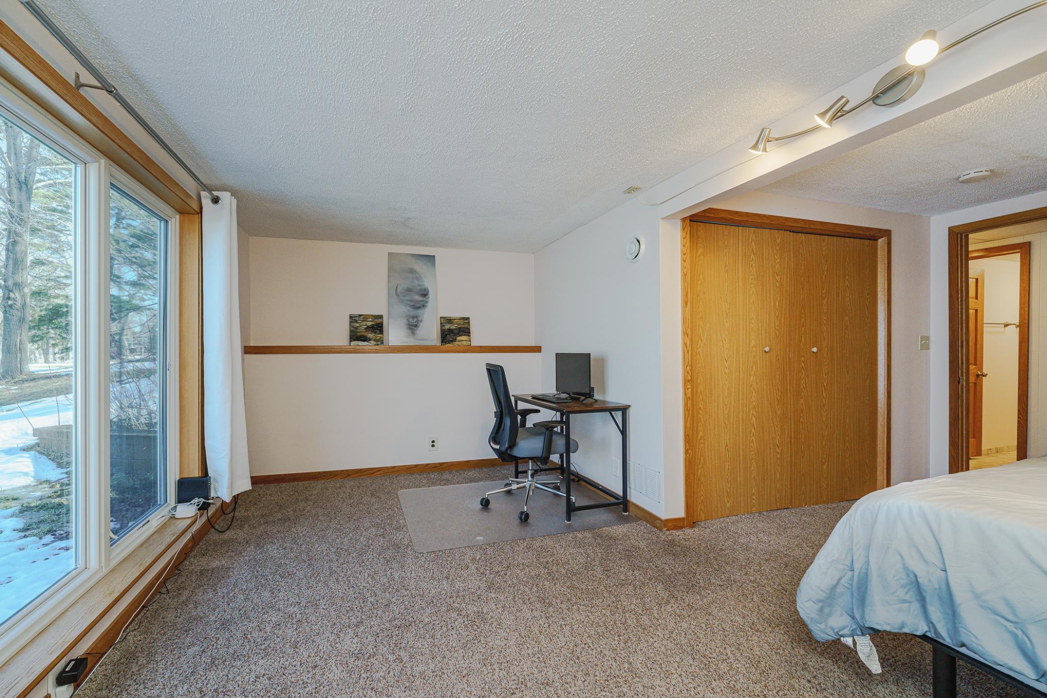This bedroom also has a desk/seating area.