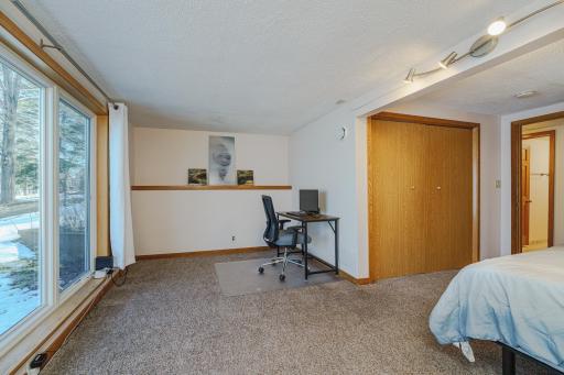 This bedroom also has a desk/seating area.