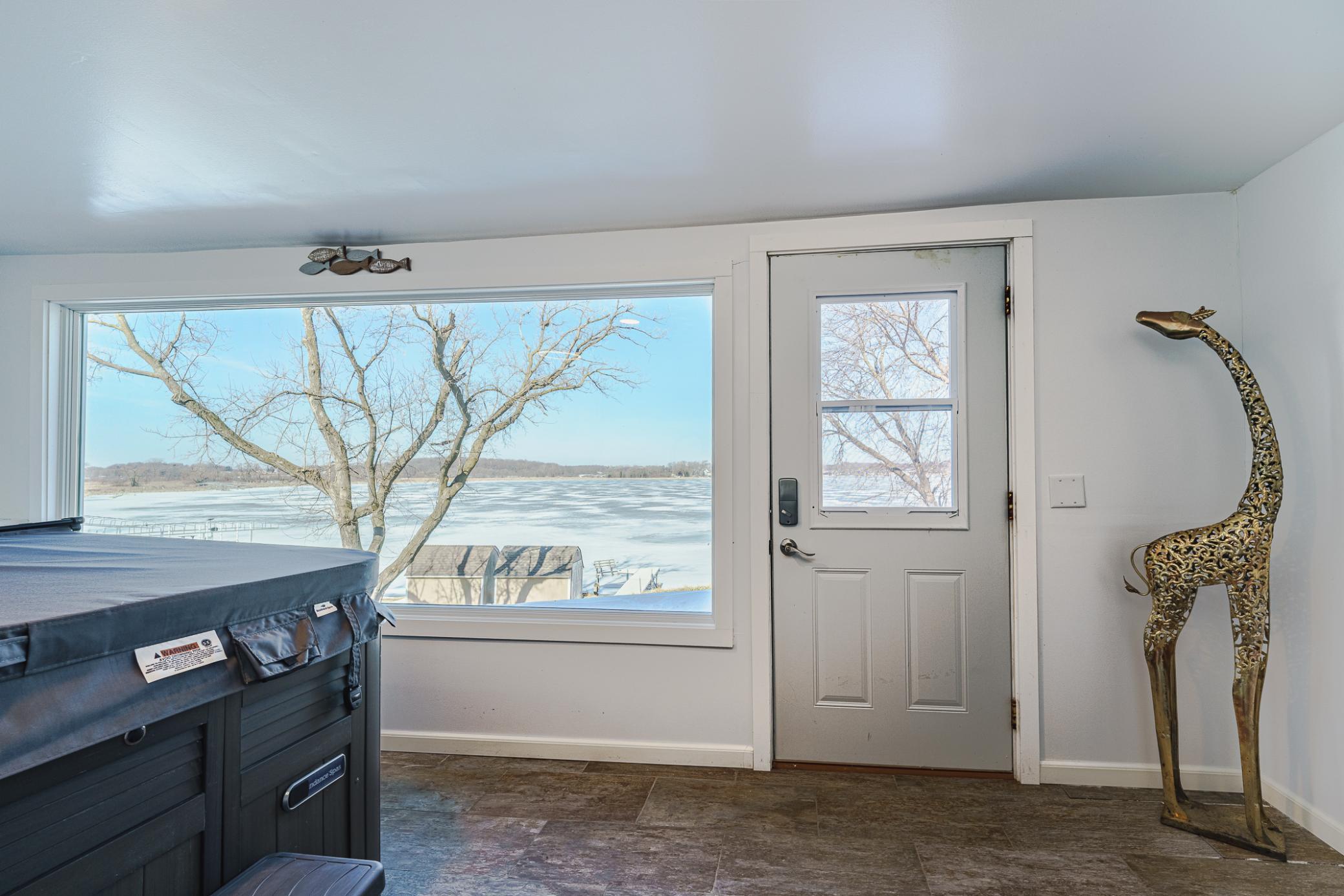 Operable windows allow air flow when desired, and the trim in this room is composite. There is a ceiling mount LED light and Bluetooth speakers.