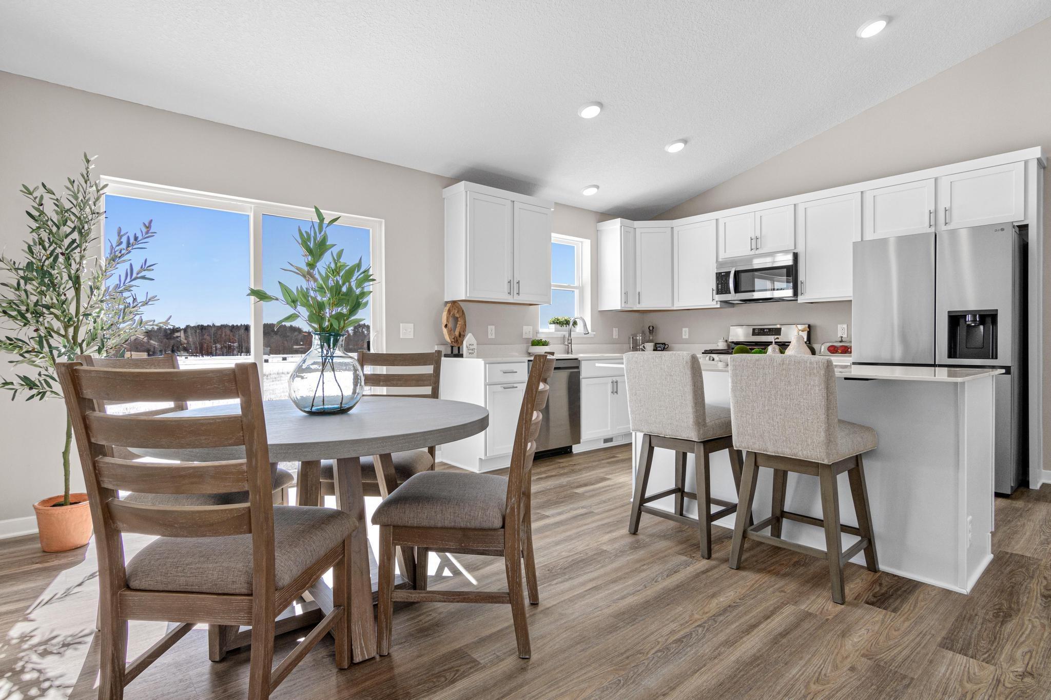 Photo taken of another home with similar plan and finishes. Photos and renderings may not depict actual plan, materials, & finishes may vary. All measurements are approximate.