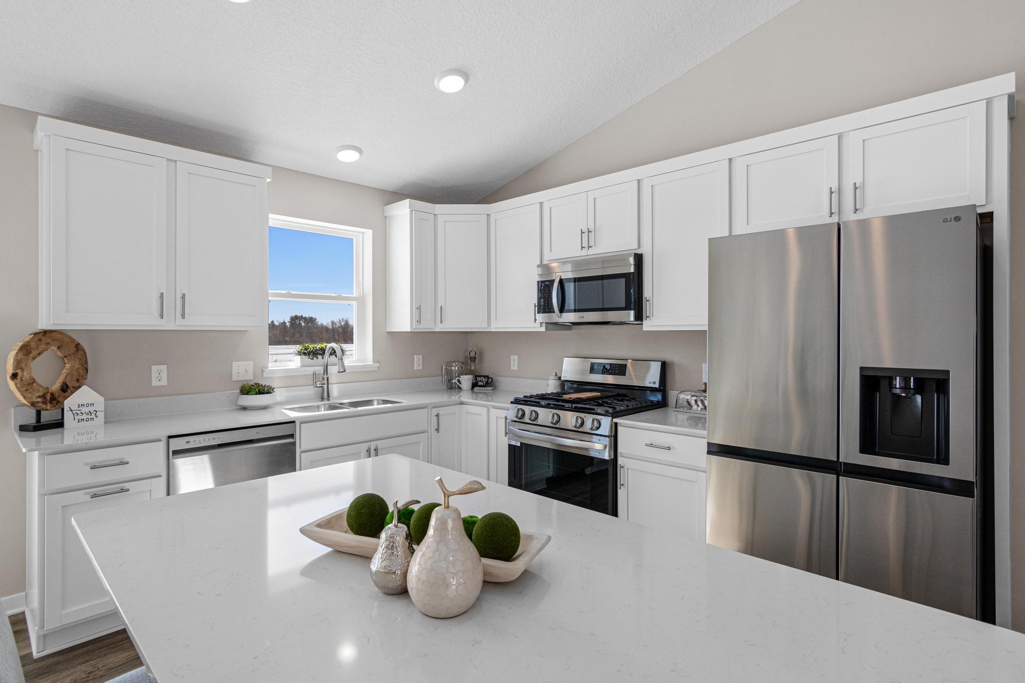 Photo taken of another home with similar plan and finishes. Photos and renderings may not depict actual plan, materials, & finishes may vary. All measurements are approximate.