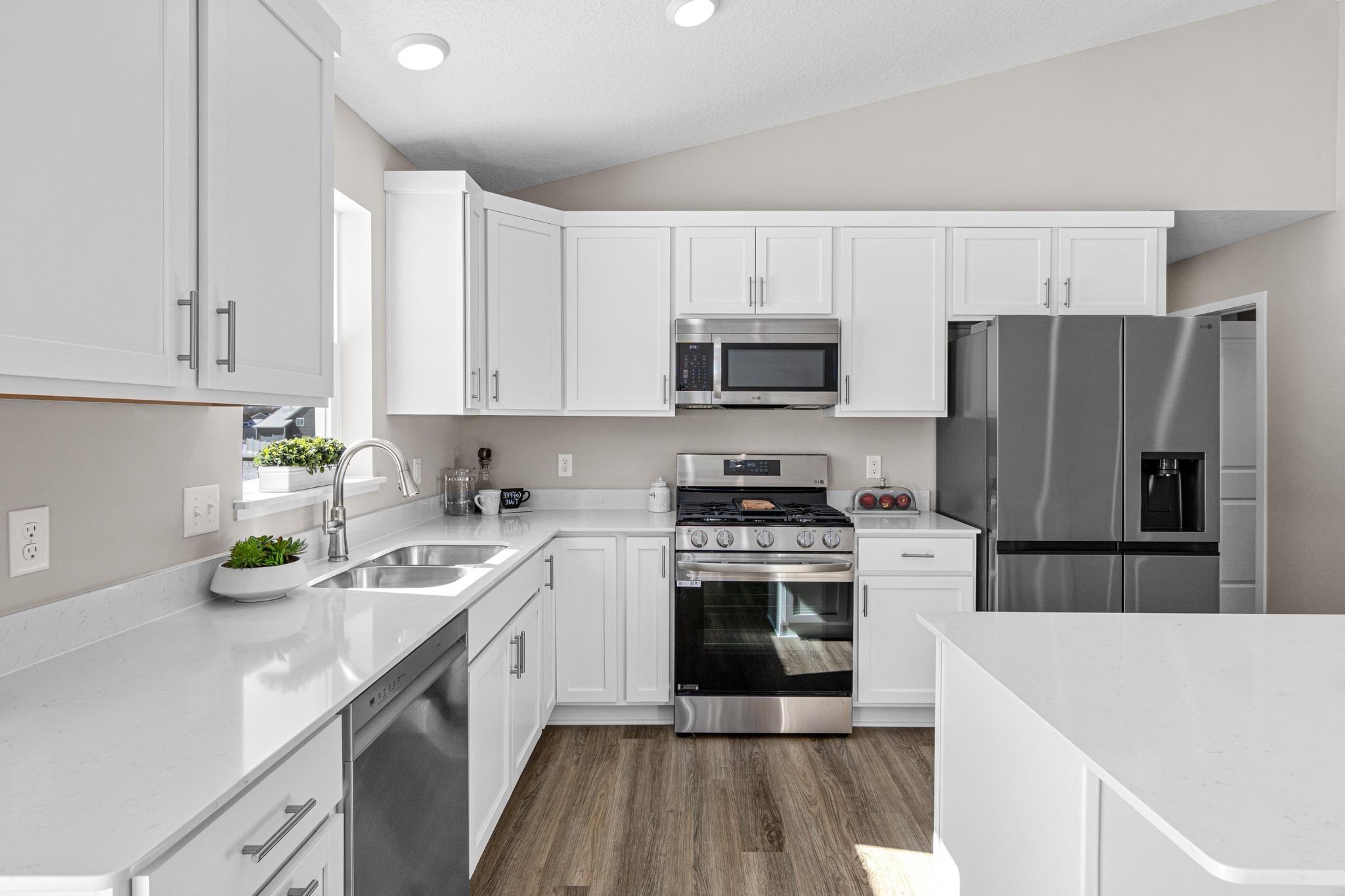 Photo taken of another home with similar plan and finishes. Photos and renderings may not depict actual plan, materials, & finishes may vary. All measurements are approximate.
