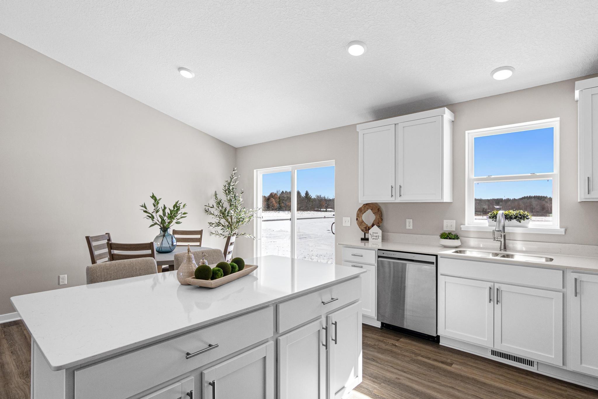 Photo taken of another home with similar plan and finishes. Photos and renderings may not depict actual plan, materials, & finishes may vary. All measurements are approximate.