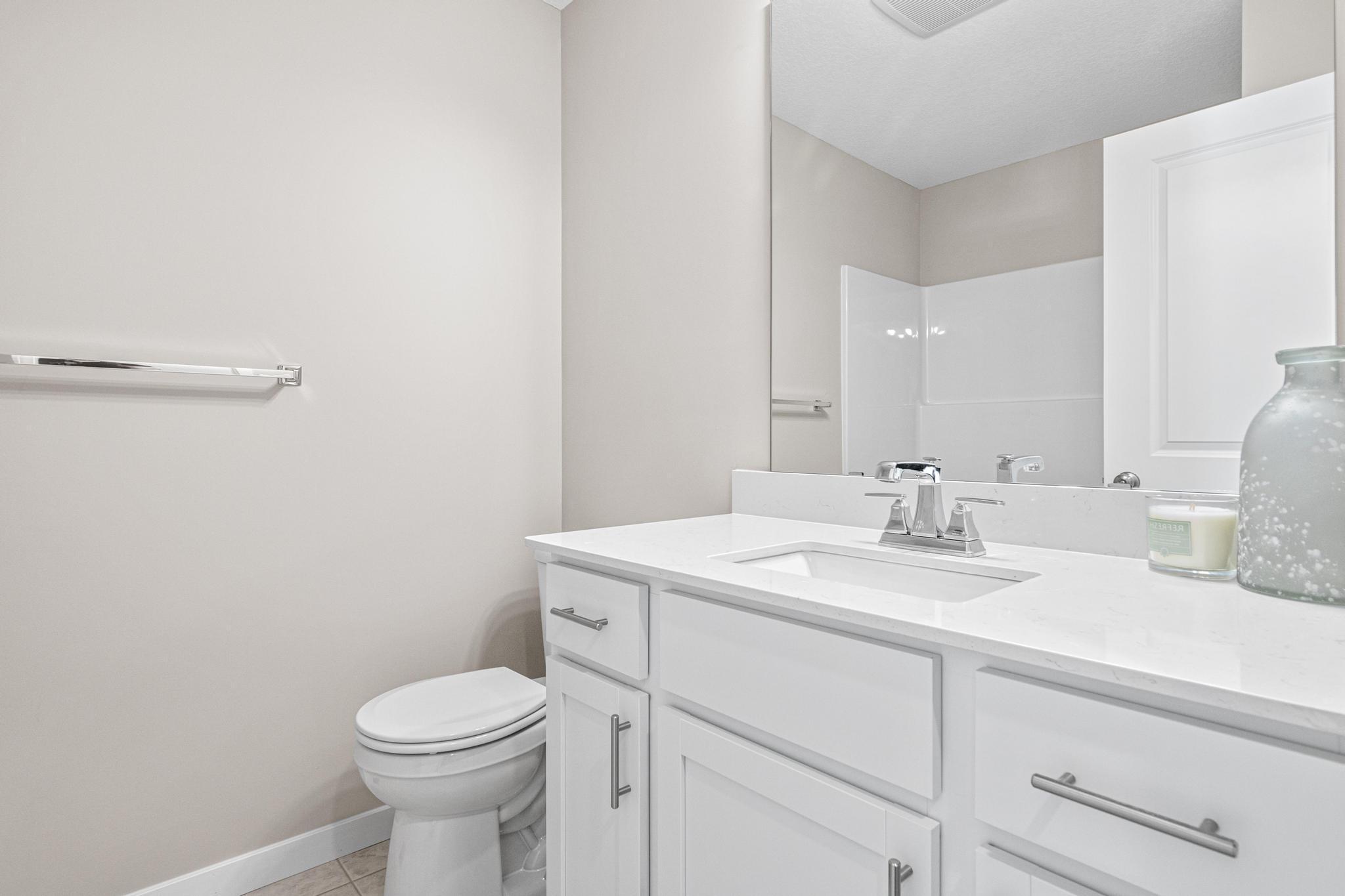 Photo taken of another home with similar plan and finishes. Photos and renderings may not depict actual plan, materials, & finishes may vary. All measurements are approximate.