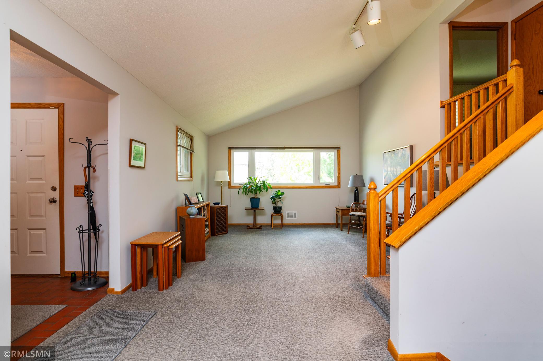 The vaulted ceiling above the living and dining rooms creates a touch of drama!