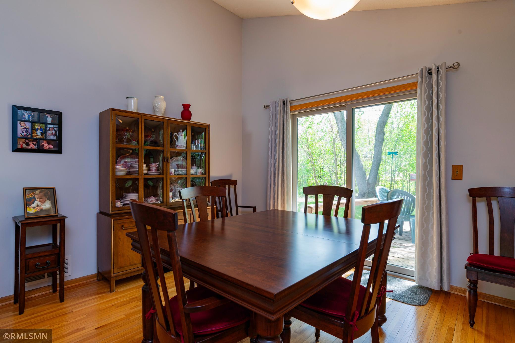 Formal dining room walks out to the large backyard deck.