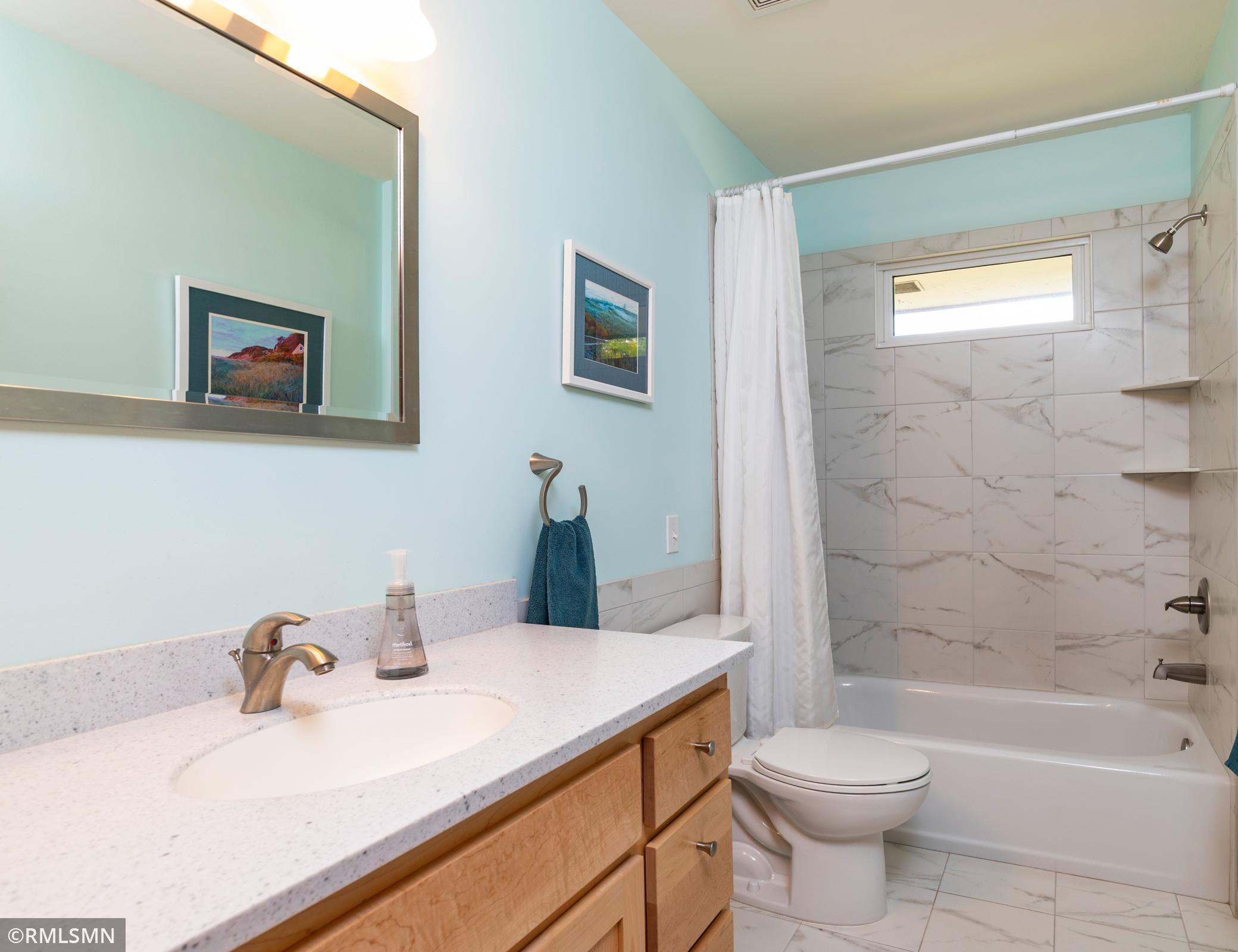 Wonderful, updated, uppermost level bathroom has a porcelain floor.