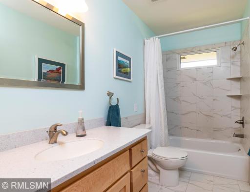 Wonderful, updated, uppermost level bathroom has a porcelain floor.