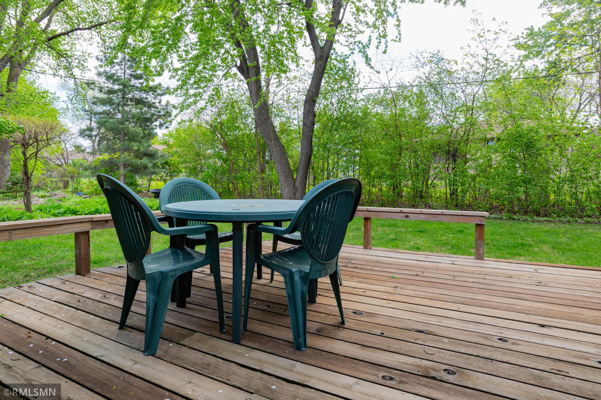 Enjoy the backyard deck surrounded by picturesque privacy!