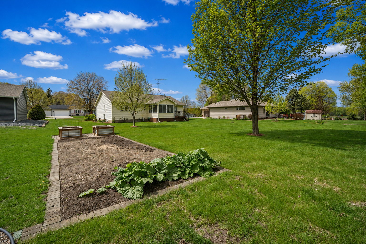 Lovely landscaping and raised vegetable garden