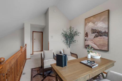 Loft is open to the vaulted living space below
