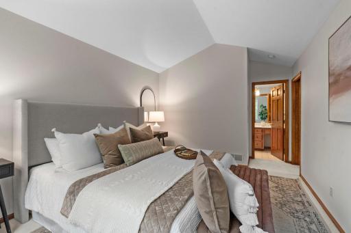 Primary bedroom with private bathroom and walk-in closet