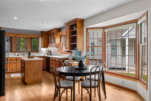 Open kitchen and eating nook with large bay window