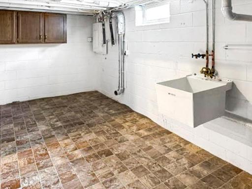 Lower level utility/laundry area with potential for future 2nd bathroom